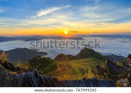 Panorama beautiful sunrise and mist at the top of Doi Pha Mon near Doi Pha Tang in Chian Rai, Thailand.
 Royalty-Free Stock Photo #767999245