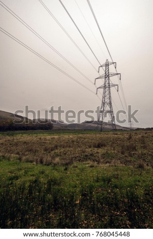 Pylons in Field - Landscape Photography