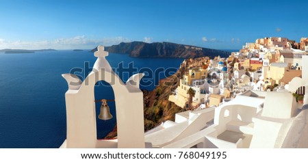 Panoramic image if Oia village, Santorini island, Greece, with bell tower in front