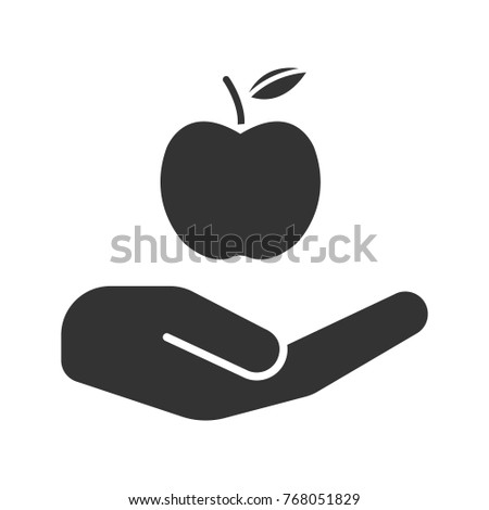 Open hand with apple glyph icon. Eco products. Silhouette symbol. Healthy food. Negative space. Raster isolated illustration