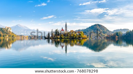 Lake Bled Slovenia. Beautiful mountain lake with small Pilgrimage Church. Most famous Slovenian lake and island Bled with Pilgrimage Church of the Assumption of Maria and reflection in calm water. Royalty-Free Stock Photo #768078298