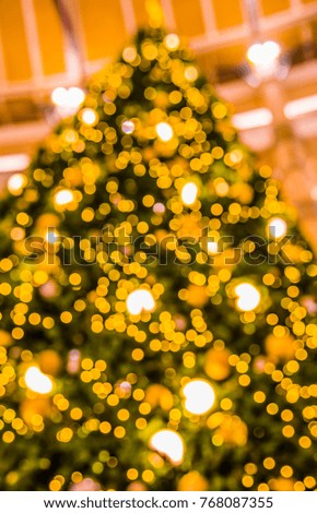 Abstract blur image of Green Christmas Tree with bokeh for background usage . (vintage tone)