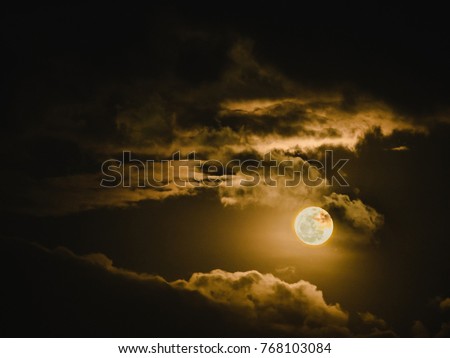 full moon with light and beauty cloudy sky in the dark night background