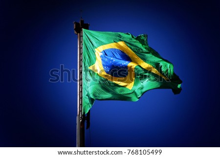 Brazilian National Flag Waving in Blue Sky