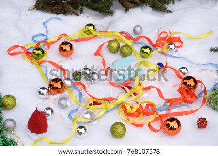 Christmas composition with box red Christmas tree balls toys candy cane star glitter coniferous branch on dark background