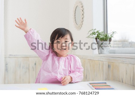 asian cute girl enjoy drawing on the table