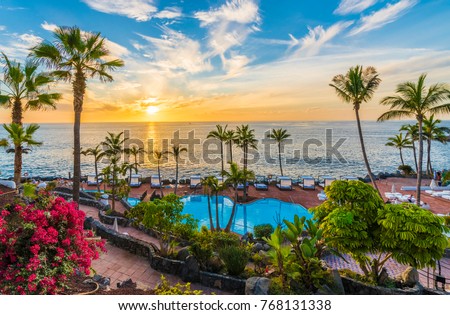 Sunset on the Adeje coast, Tenerife, Spain Royalty-Free Stock Photo #768131338