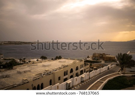 beautiful scenic landscape of the Egyptian embankment. white chic hotel blue azure sea in the background of the city. Wallpaper. Postcard