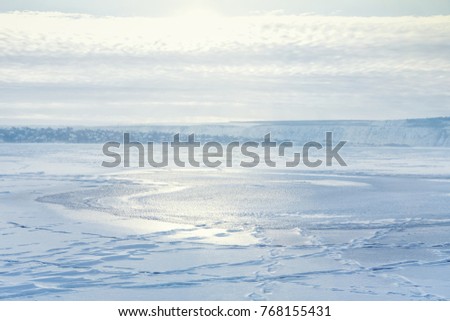 white winter landscape with frozen lake 
