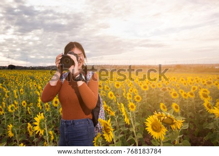 Asian Youth Culture Travel Holiday Relaxation Concept sunflower garden,Silhouette.