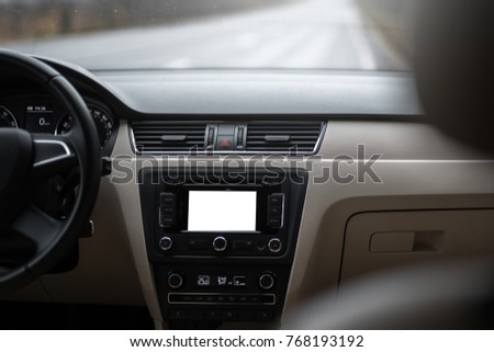 Car navigation system in modern car interior with mock up. Isolated display of multimedia.
