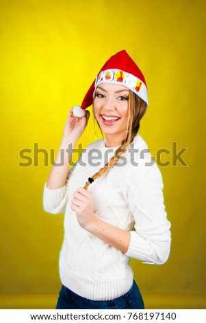 Beautiful girl in winter clothes smiling holiday christmas concept celebration taking pictures posing and sending kisses