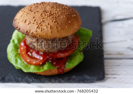 light burger on the white wooden table