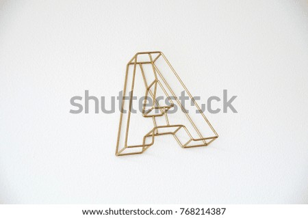 A golden capital letter A in a white background