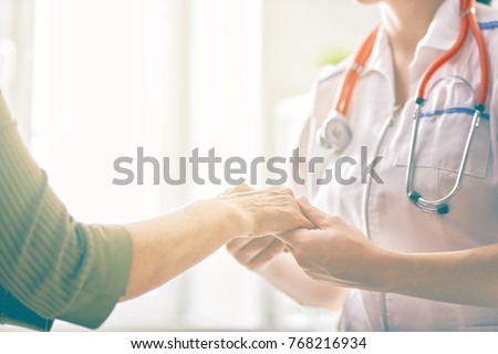 Female patient listening to doctor in medical office. Royalty-Free Stock Photo #768216934