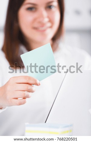 Smiling woman worker working effectively on project in office