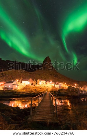 Northern lights over the Reine fishing village, Lofoten islands, Norway
