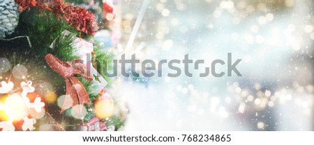 Christmas tree with ornaments.  Holiday glowing backdrop. Defocused Background With Blinking Stars. Blurred Bokeh.