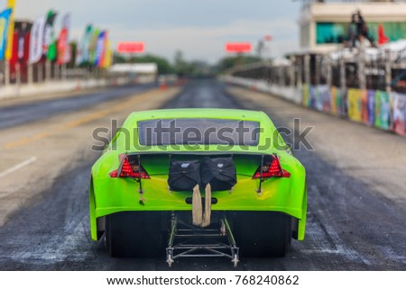 Dragster race car down the race track, Dragster racing car in preparation for the qualifying run. Royalty-Free Stock Photo #768240862