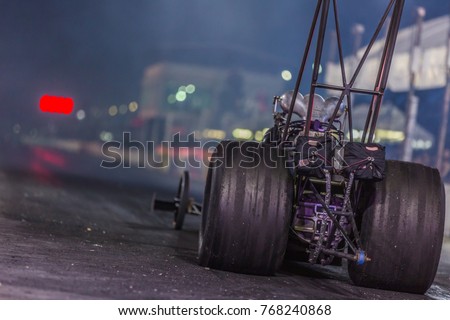 Dragster race car down the race track, Dragster racing car in preparation for the qualifying run. Royalty-Free Stock Photo #768240868