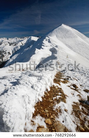 Winter landscape in the Western Tatras. A view of the Starorobocianski Wierch peak. Mountains in the winter. Slovakia, Poland.