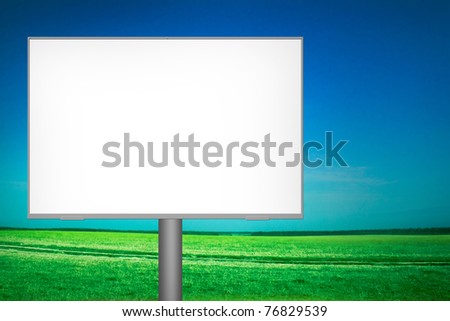 empty billboard standing in a field of grass