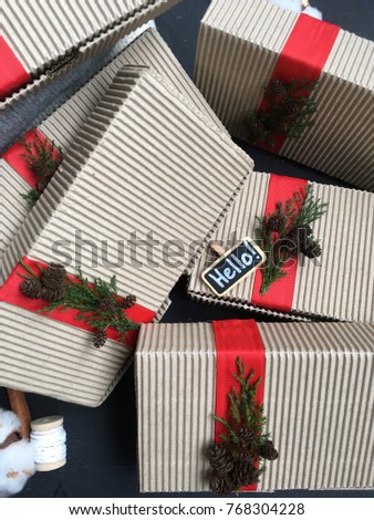 hello chalkboard with boxes with red ribbon. craft christmas boxes