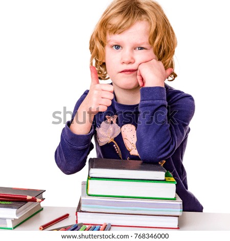 Girl with stack of books and crayons

