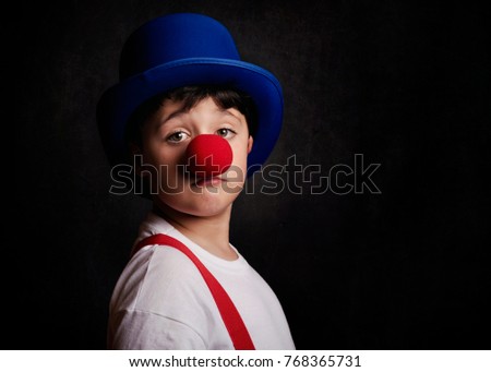 funny boy with clown nose

