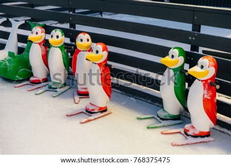 Shot of colorful figures in shape of penguins, needed for skating on ice rink, help people to keep balance and not fall down and being injured