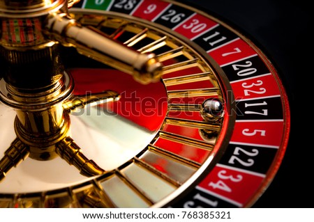 Gambling, casino games and the gaming industry concept with seventeen the winning number, 17 is a black number on the roulette wheel Royalty-Free Stock Photo #768385321