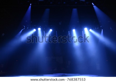 the rays of light on a dark background Royalty-Free Stock Photo #768387553