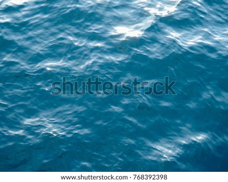 Water surface of the Gulf of Oman at sunset under the sun. Ancient pirate sea