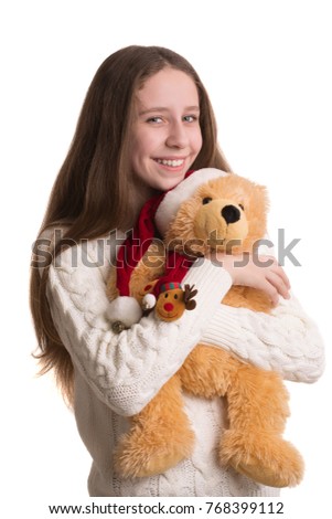Portrait of a beautiful girl with a teddy bear on a white background.
