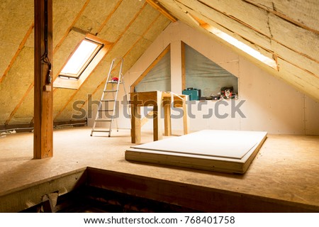 house attic under construction mansard wall insulation with rock wool Royalty-Free Stock Photo #768401758