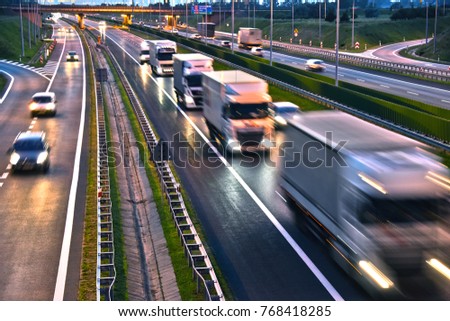 Trucks on four lane controlled-access highway in Poland.
 Royalty-Free Stock Photo #768418285
