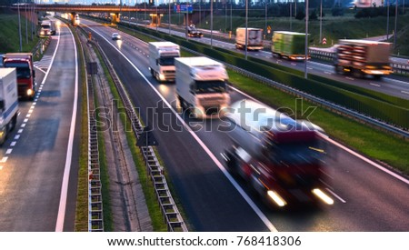 Trucks on four lane controlled-access highway in Poland.
 Royalty-Free Stock Photo #768418306