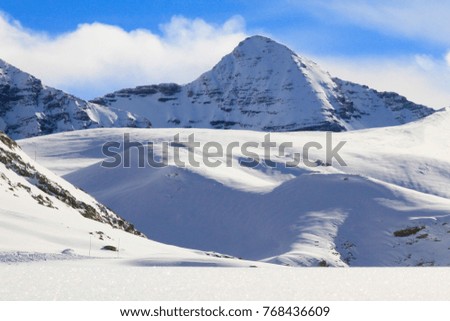Beautiful winter landscape with snow and blue sky in French Alps, Hautes-Alpes, France 