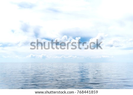 Cloudy sky above a quiet sea, seascape, sky background, place for text