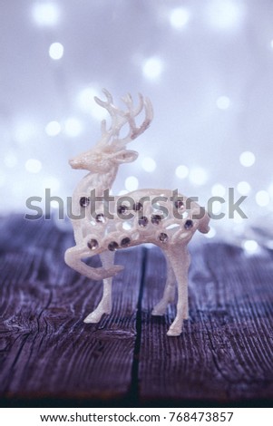 Reindeer on wooden board. Christmas deer. Christmas decoration.