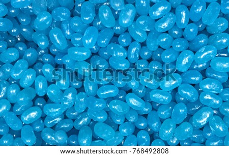 Colorful light blue jellybeans with space for text. Can be used as a background. Royalty-Free Stock Photo #768492808
