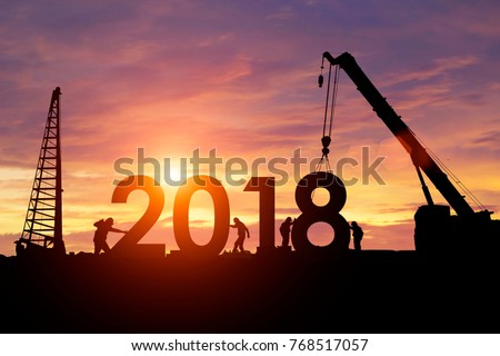 Silhouette workers work constructively to create. 2018 New Year Royalty-Free Stock Photo #768517057