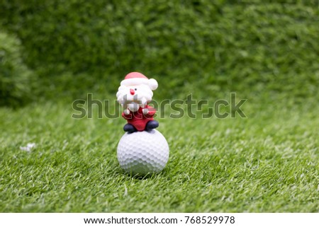 Golf ball with Christmas decoration for golfer on Christmas holiday