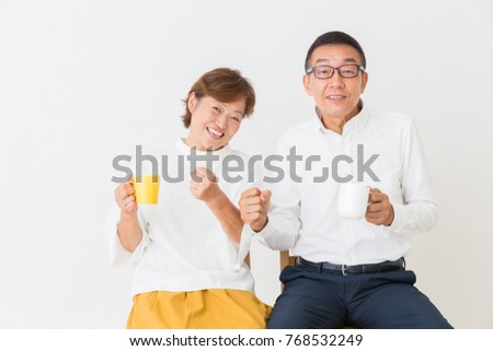 asian senior couple who drink coffee