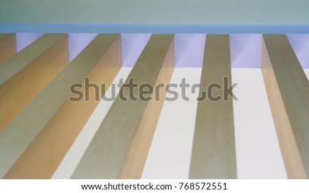 The room wall is made of wooden sticks of a modern home in an empty room.