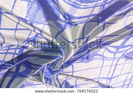 Silk. The fabric is white in steel, the fabric is colored with blue lines. Fix it with this exciting patchwork ! This material is slightly transparent, pleasantly soft and contains an elegant drapery.