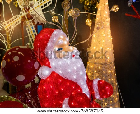 Santa Claus with LED lamp , symbol of the new year