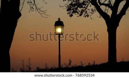 Bergamo old city. Lombardy, Italy. Silhouette of light pole during the sunset