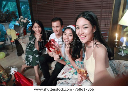 image of celebrating holiday together with friends (christmas party concept)
