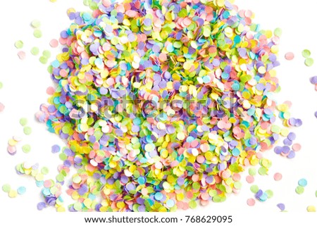 Confetti scattered in different colors on a white background. Festive confetti. The decor for the party.